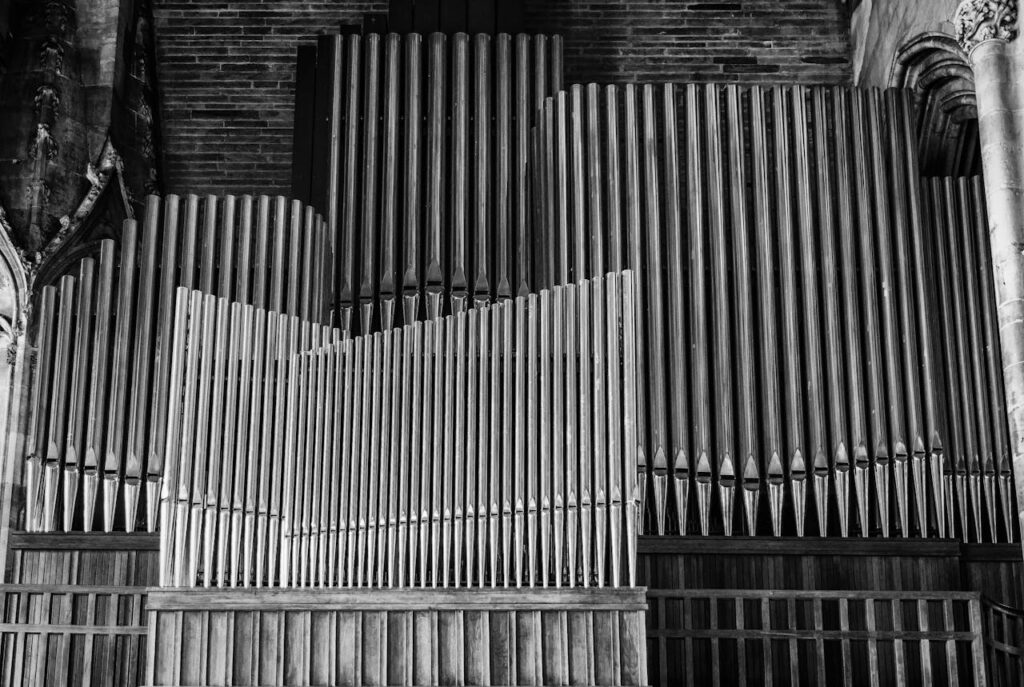 pexels photo 221576 Beautiful monochrome image of a church's pipe organ showcasing intricate details and architecture.